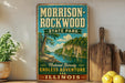 A vintage-style sign for Morrison-Rockwood State Park in Illinois, featuring a scenic illustration of a river and lush greenery.