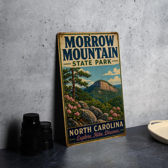 A vintage-style metal sign for Marrow Mountain State Park, featuring a scenic illustration of the mountain landscape with pine trees and rocks.