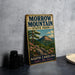 A vintage-style metal sign for Marrow Mountain State Park, featuring a scenic illustration of the mountain landscape with pine trees and rocks.