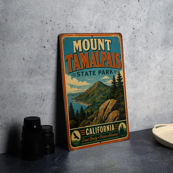 A vintage-style metal sign for Mount Tamalpais State Park in California, featuring a scenic mountain landscape and the park's name.
