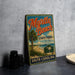A vintage-style metal sign for Myrtle Beach State Park in South Carolina, featuring a palm tree and beach scene.
