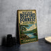 A vintage-style sign for Nathan Bedford Forrest State Park in Tennessee, featuring a scenic landscape with a lake and mountains.