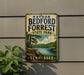 A vintage-style metal sign for Nathan Bedford Forrest State Park in Tennessee, featuring a scenic landscape with a lake and mountains.