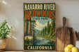 A vintage-style sign for Navarro River Redwoods State Park in California, featuring a scenic illustration of the park's natural landscape.