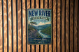 A vintage-style metal sign for New River State Park in North Carolina, featuring a scenic illustration of a river and mountains.