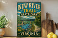 a vintage-style sign for the New River Trail State Park in Virginia, with a scenic illustration of a river, bridge, and surrounding landscape.
