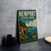 A vintage-style metal sign for Newport State Park in Wisconsin, featuring a scenic landscape with a lake, cliffs, and a sailboat.
