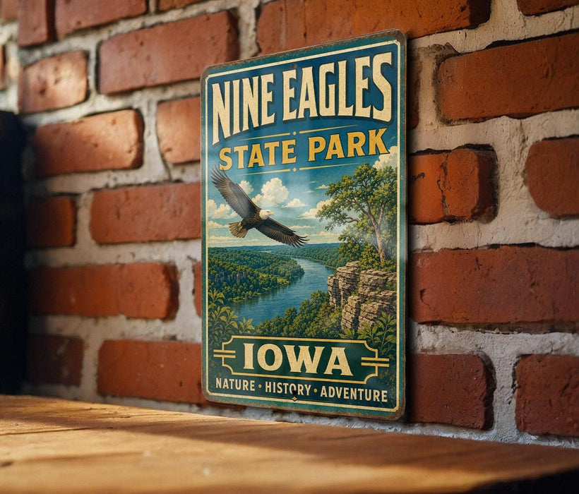 A vintage-style metal sign for Nine Eagles State Park in Iowa, featuring an eagle in flight and a scenic landscape.