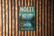 A vintage metal sign for NOLTE State Park in Washington, featuring a scenic mountain landscape with pine trees and a lake.