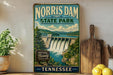 A vintage-style sign for Norris Dam State Park in Tennessee, featuring a scenic illustration of the dam and surrounding landscape.