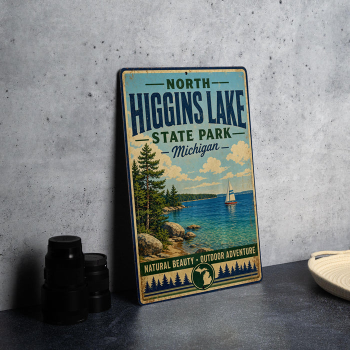 A vintage-style sign for North Higgins Lake State Park in Michigan, featuring a scenic image of the lake and surrounding landscape.
