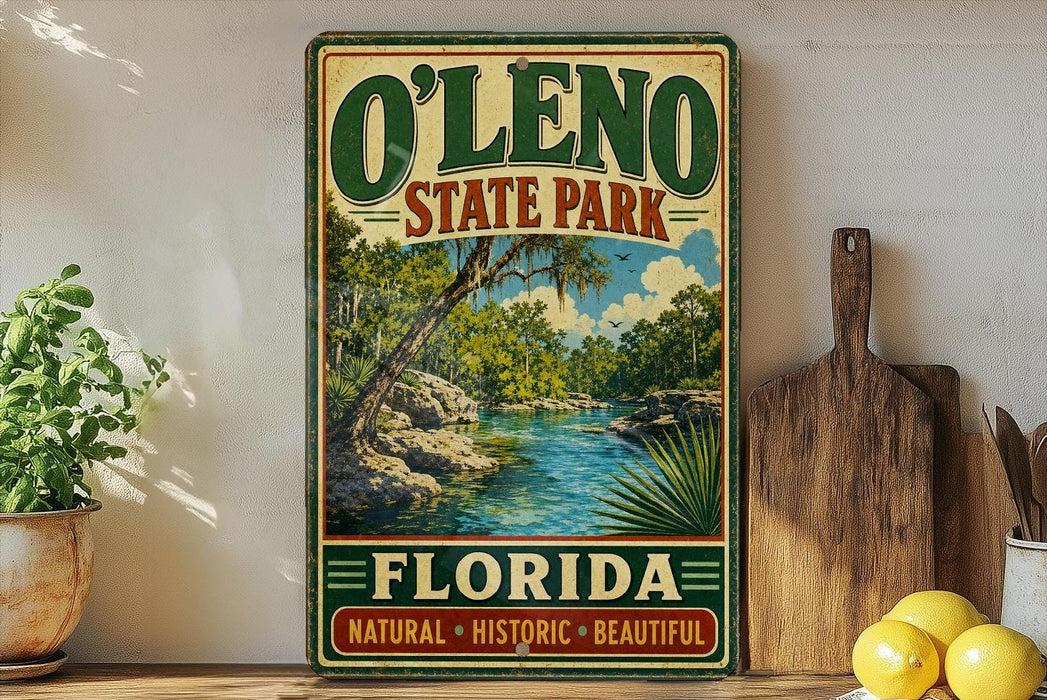 A vintage-style sign for O'Leno State Park in Florida, featuring a scenic landscape with a river and palm trees.