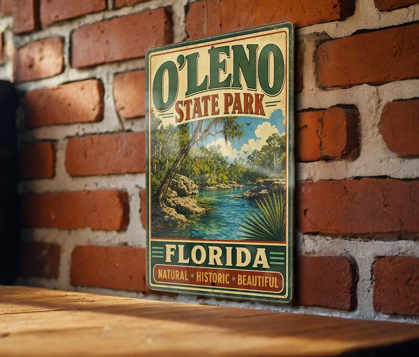 A vintage-style sign for O'Leno State Park in Florida, featuring a scenic landscape with a river and palm trees.
