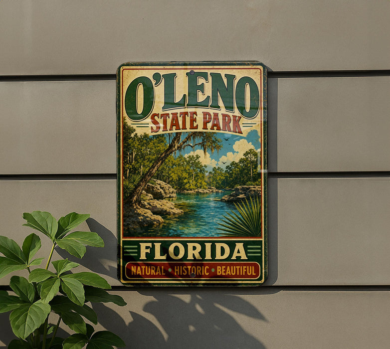 A vintage-style sign for O'Leno State Park in Florida, featuring a scenic landscape with palm trees and a river.