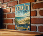 A vintage-style metal sign for Ocean City State Park, featuring a beach scene and the text "Ocean City State Park" prominently displayed.