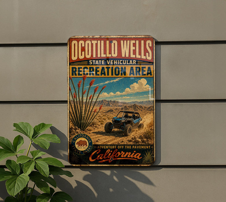 A vintage-style metal sign for the Ocotillo Wells State Vehicular Recreation Area, featuring a desert landscape with a blue off-road vehicle and a cactus plant.