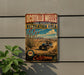 A vintage-style metal sign for the Ocotillo Wells State Vehicular Recreation Area, featuring a desert landscape with a blue off-road vehicle and a cactus plant.