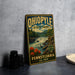 A vintage-style metal sign for Ohio State Park, featuring a scenic illustration of a waterfall and forest, is displayed on a gray countertop next to some black camera lenses.