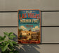 A vintage-style sign for Old Las Vegas Mormon Fort, featuring a wagon and a desert landscape, mounted on a wall.