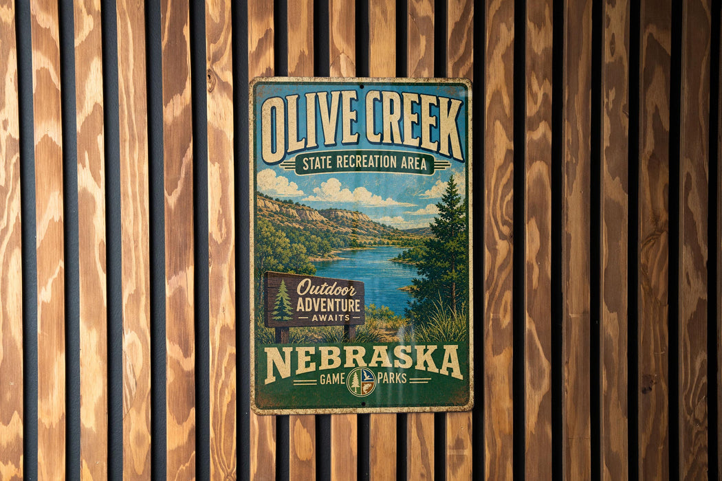 A vintage-style metal sign for Olive Creek State Recreation Area in Nebraska, featuring a scenic landscape with a lake and mountains.