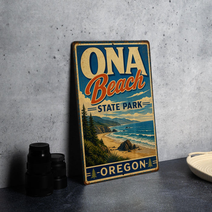 A vintage-style metal sign for Oona Beach State Park in Oregon, featuring a scenic beach landscape with mountains in the background.