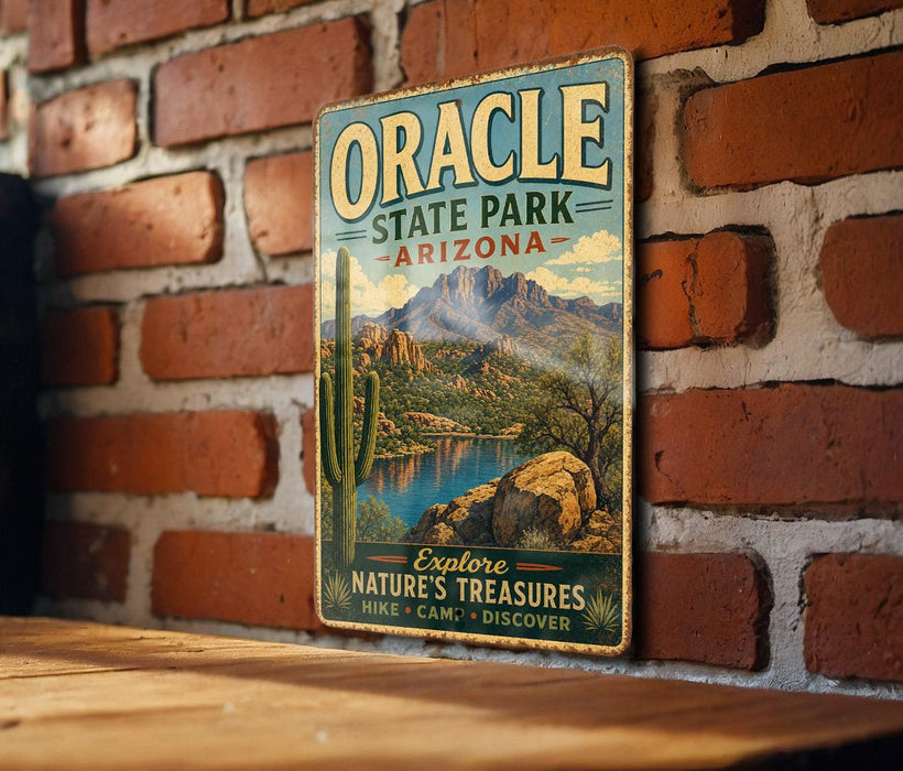 A vintage-style metal sign for Oracle State Park in Arizona, featuring a scenic landscape with mountains, a desert lake, and a cactus.