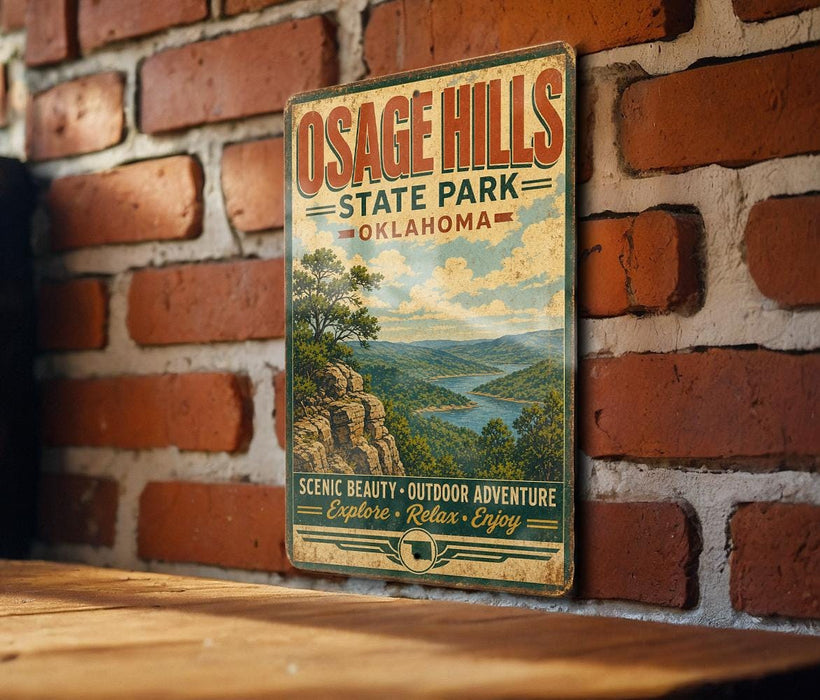A vintage-style metal sign for Osage Hills State Park in Oklahoma, featuring a scenic landscape with mountains, trees, and a river.