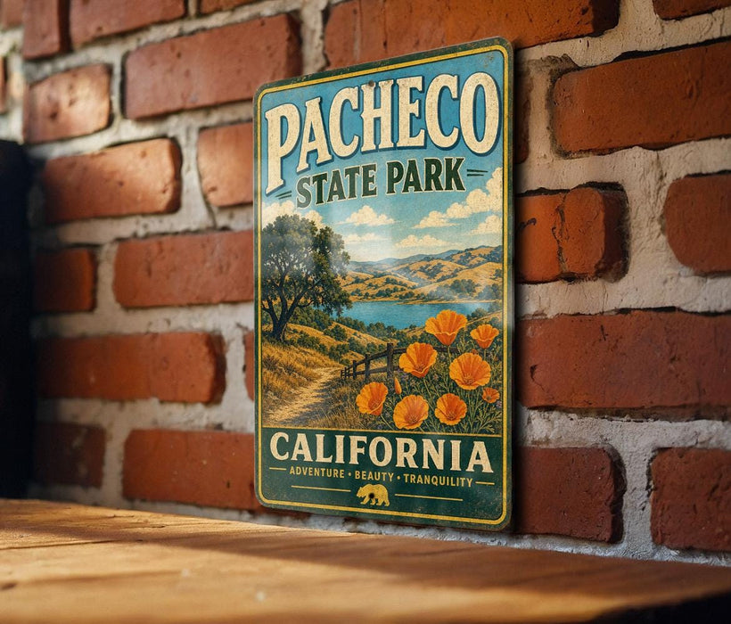 A vintage-style metal sign for Pacheco State Park in California, featuring a scenic landscape with a path, trees, and flowers.
