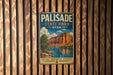 A vintage metal sign for Palisade State Park in Utah, featuring a scenic landscape with a mountain and a lake.