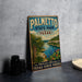 A vintage-style metal sign for Palmetto State Park in Texas, featuring a scenic landscape with palm trees, cacti, and a body of water.