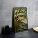 A vintage-style metal sign for Palm Book State Park in Michigan, featuring a tropical beach scene with palm trees and a body of water.