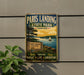 A vintage-style metal sign for Paris Landing State Park in Tennessee, featuring a scenic image of the park with a lake, trees, and a sailboat.