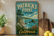 A vintage-style sign for Patrick's Point State Park in California, featuring a scenic coastal landscape with mountains, trees, and the ocean.