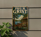 A vintage metal sign for Paul M. Grist State Park, featuring a scenic image of a lake, cabin, and trees.