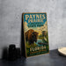 A vintage metal sign for the park, featuring an illustration of a bison and a bird, with text promoting the park's features and attractions.
