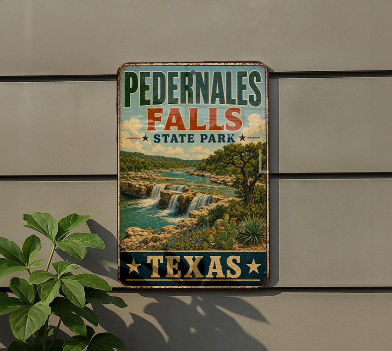 A vintage-style sign for Pedernales Falls State Park in Texas, featuring a scenic landscape with waterfalls and lush vegetation.
