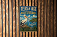 A vintage-style metal sign for Pelican Lake State Recreation Area in South Dakota, featuring a white pelican and a scenic landscape.