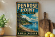 A vintage-style sign for Penrose Point State Park in Washington, featuring a scenic landscape with a mountain, pine trees, and a lake with a sailboat.
