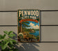 A vintage-style metal sign for Penwood State Park in Connecticut, featuring a scenic landscape with a lake, trees, and a cabin.