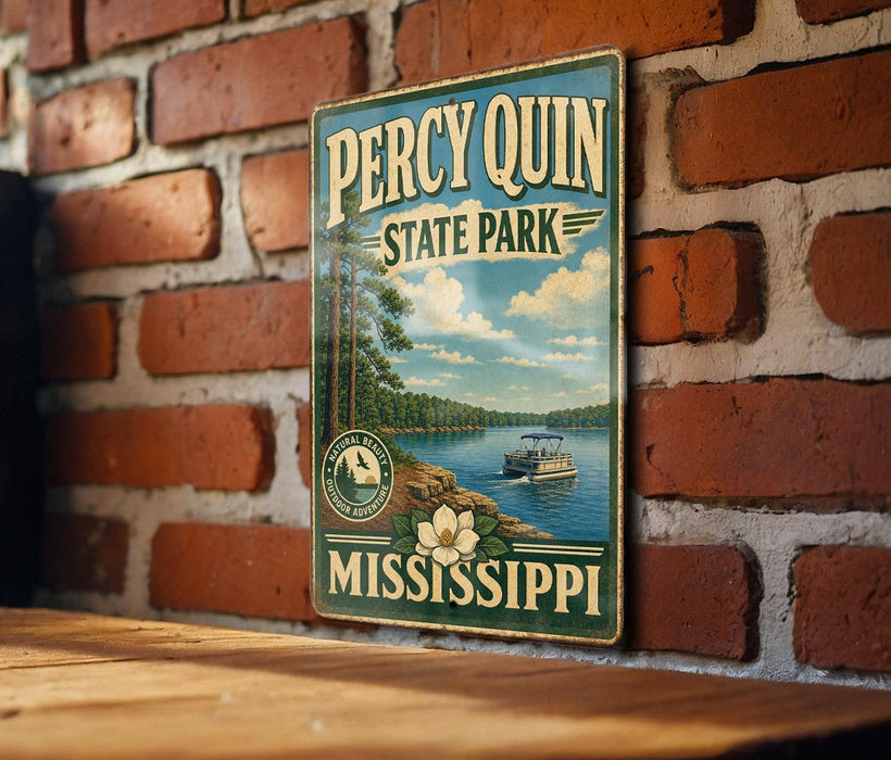 A vintage-style metal sign for Percy Quinn State Park in Mississippi, featuring a scenic image of a lake and a boat.