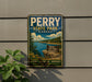 A vintage-style metal sign for Perry State Park in Kansas, featuring a scenic landscape with a lake, mountains, and a sign indicating the park's name.