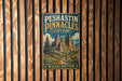 A vintage metal sign for Peshtin Pinnacles State Park in Washington, featuring a mountain landscape with a trail leading through it.