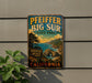 A vintage-style metal sign for Pfeiffer Big Sur State Park, featuring a scenic landscape with mountains, a beach, and a tunnel.