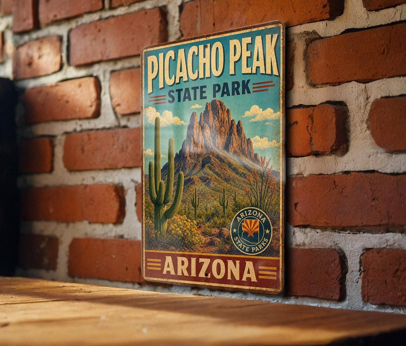 A vintage-style metal sign for Picacho Peak State Park in Arizona, featuring a desert landscape with mountains and cacti.