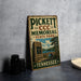 A vintage metal sign for the PickettCCC Memorial State Park in Tennessee, featuring a scenic illustration of the park and a bridge.