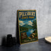 A vintage-style sign for Pillsbury State Park in New Hampshire, featuring a scenic mountain landscape and inviting visitors to explore, relax, and swim in the nearby lake.