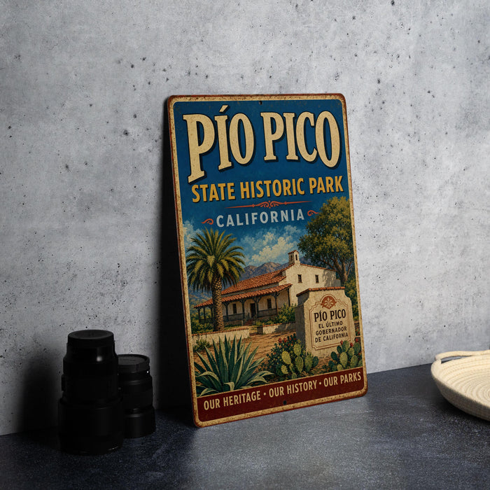 A vintage-style metal sign for Pio Pico State Historic Park in California, featuring an illustration of a historic building surrounded by palm trees and other vegetation.