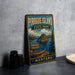 A vintage-style sign for Pirogue Island State Park in Montana, featuring a scenic illustration of the island and its surrounding landscape.