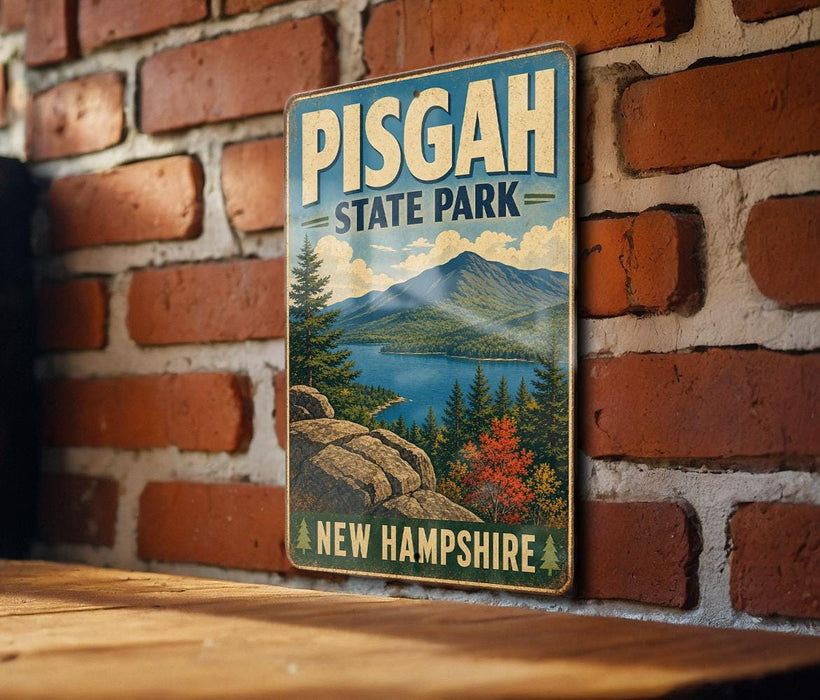 A vintage-style metal sign for Pisgah State Park in New Hampshire, featuring a scenic landscape with mountains, pine trees, and a lake.