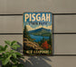 A vintage-style metal sign for Pisgah State Park in New Hampshire, featuring a scenic mountain landscape with pine trees and a lake.